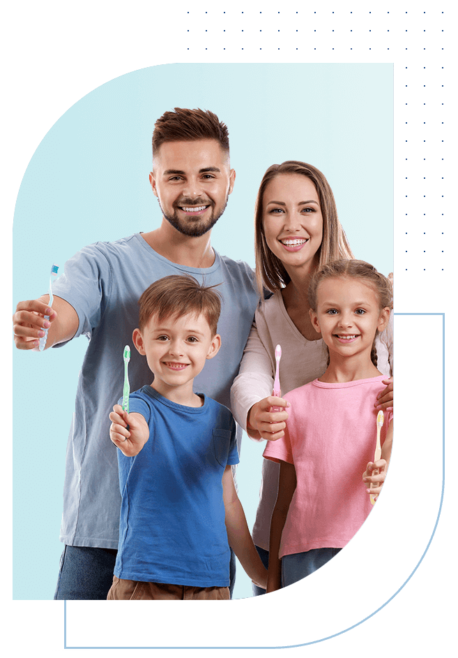 a man woman and two children holding toothbrushes